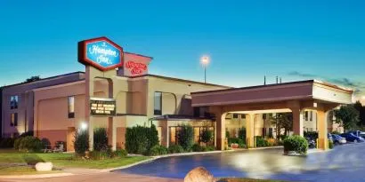Hotel entrance and parking area at Hampton Inn Columbus-East. 