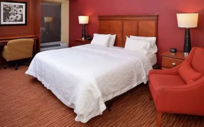 Day use room with work desk and sofa at Hampton Inn Columbus-East.