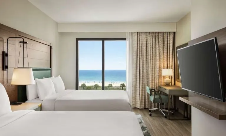 Day use twin room with sea view, work desk and private bathroom at Embassy Suites By Hilton Panama City Beach Resort.