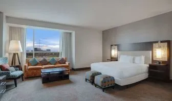 Spacious meeting room with living area at Hilton Dallas/ Plano Granite Park.
