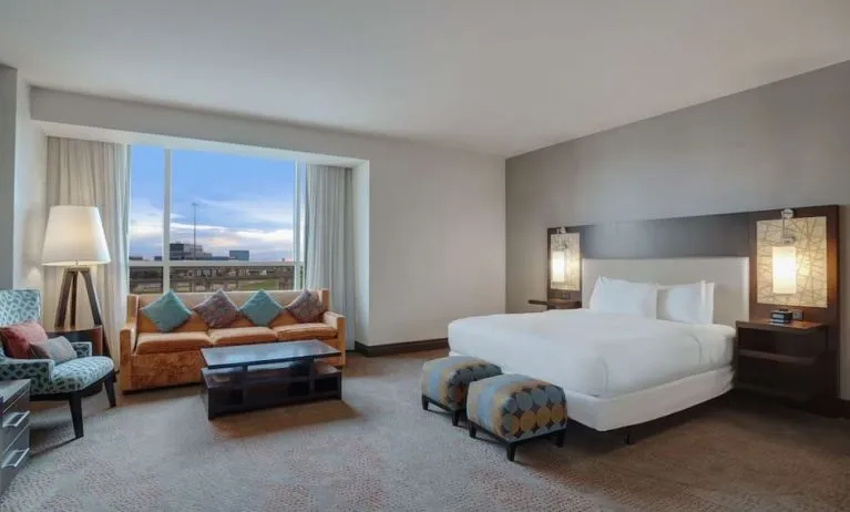 Spacious meeting room with living area at Hilton Dallas/ Plano Granite Park.
