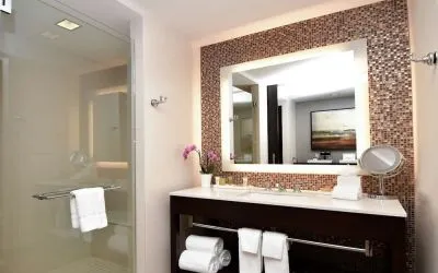 Guest bathroom with shower at Hilton Dallas/ Plano Granite Park.