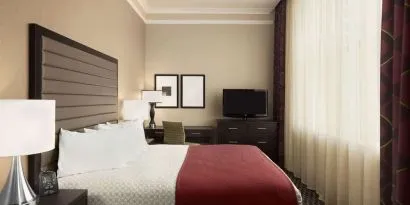 Day use room with work desk and natural light at Embassy Suites By Hilton St. Louis Downtown.