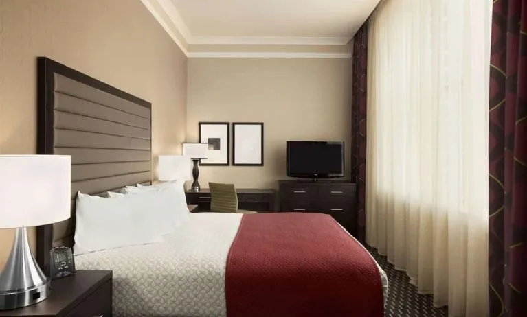 Day use room with work desk and natural light at Embassy Suites By Hilton St. Louis Downtown.