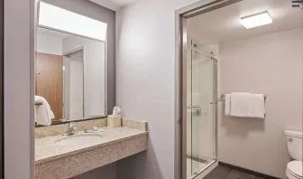 Guest bathroom with shower at Sonesta Select Phoenix Chandler.