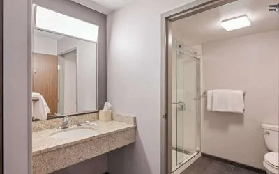 Guest bathroom with shower at Sonesta Select Phoenix Chandler.
