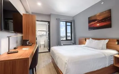 Day use room with work desk and natural light at Liberty View Brooklyn Hotel.