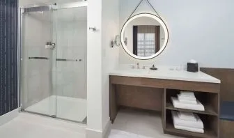 Guest bathroom with shower at The Chifley Houston, Tapestry Collection By Hilton.