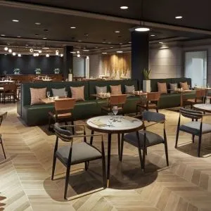 Dining area perfect for coworking at The Chifley Houston, Tapestry Collection By Hilton.