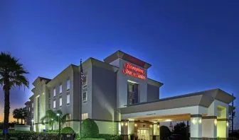 Hotel exterior at night at Hampton Inn & Suites Houston-Bush Intercontinental Aprt.