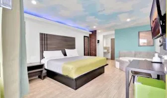 Day use room with TV at Exclusivo Inn & Suites. 