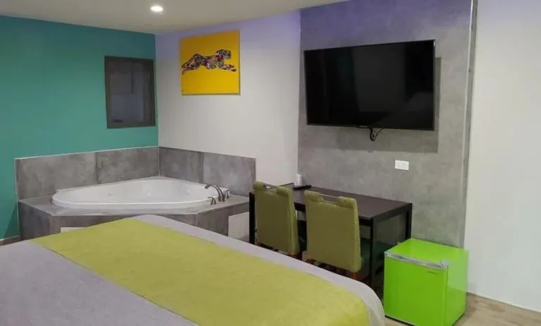 Day use room with TV at Exclusivo Inn & Suites. 