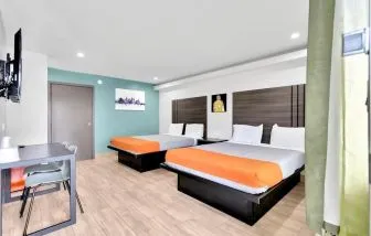Day use room with TV at Exclusivo Inn & Suites.