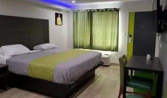 Day use room with TV at Exclusivo Inn & Suites. 