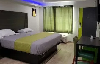 Day use room with TV at Exclusivo Inn & Suites.