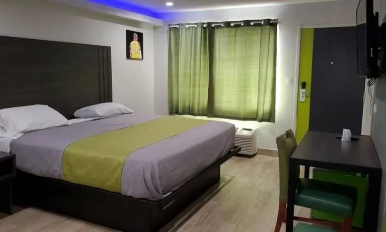 Day use room with TV at Exclusivo Inn & Suites. 