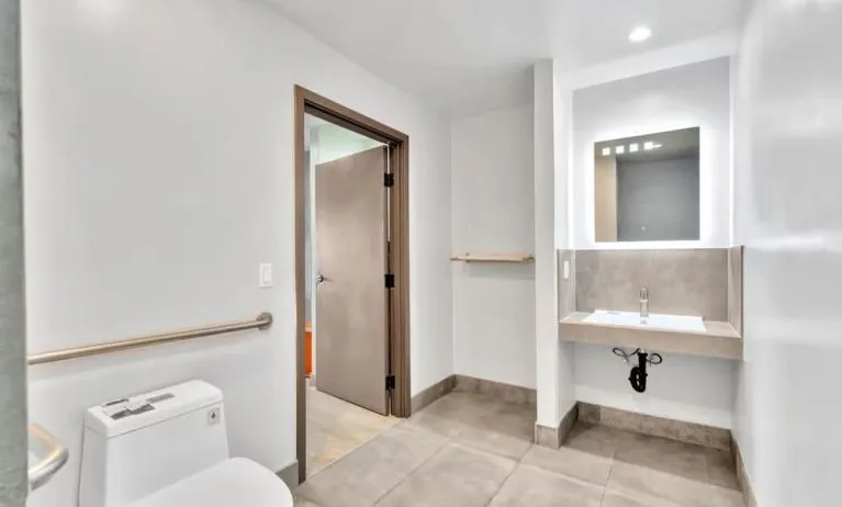 Private guest bathroom with shower at Exclusivo Inn & Suites. 