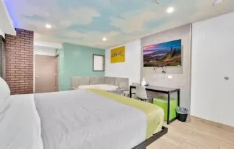 Day use room with TV at Exclusivo Inn & Suites.