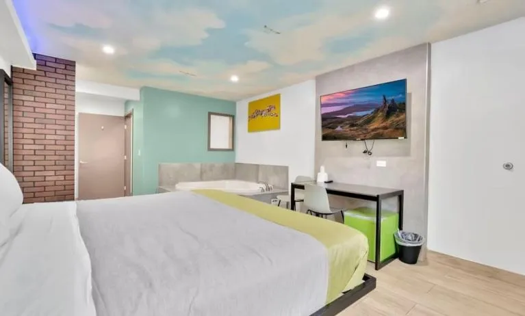 Day use room with TV at Exclusivo Inn & Suites. 