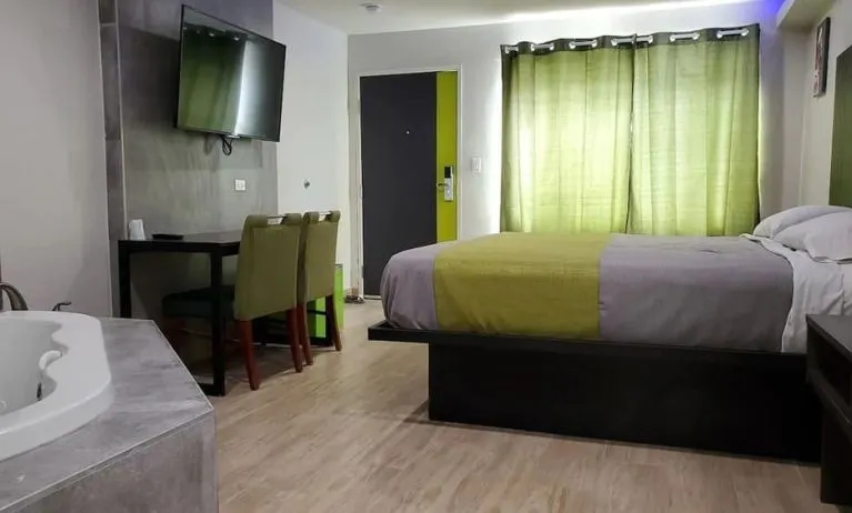 Day use room with TV at Exclusivo Inn & Suites. 