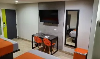 Day use room with TV at Exclusivo Inn & Suites. 