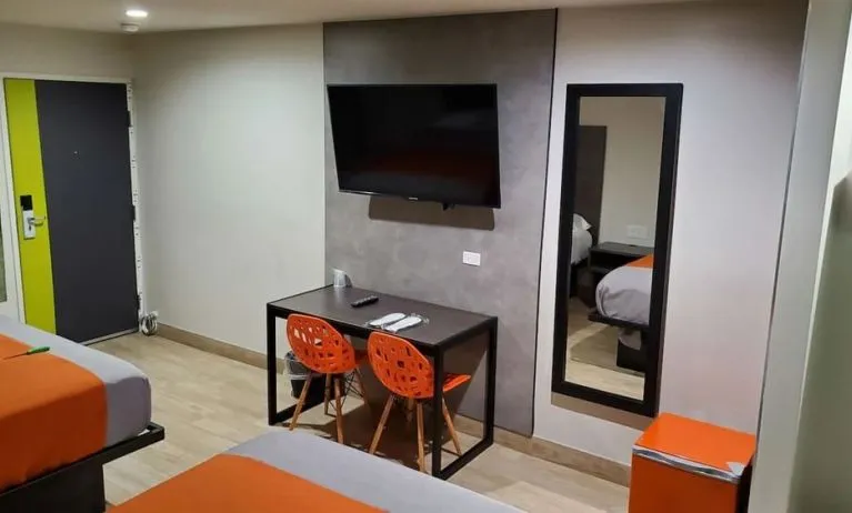 Day use room with TV at Exclusivo Inn & Suites. 