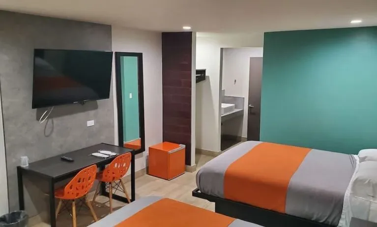 Day use room with TV at Exclusivo Inn & Suites. 
