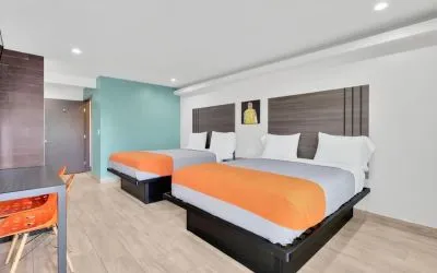 Day use room with TV at Exclusivo Inn & Suites. 