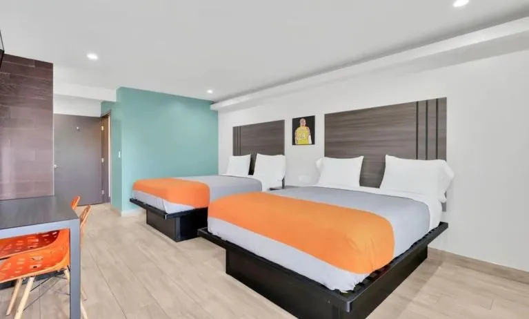 Day use room with TV at Exclusivo Inn & Suites. 