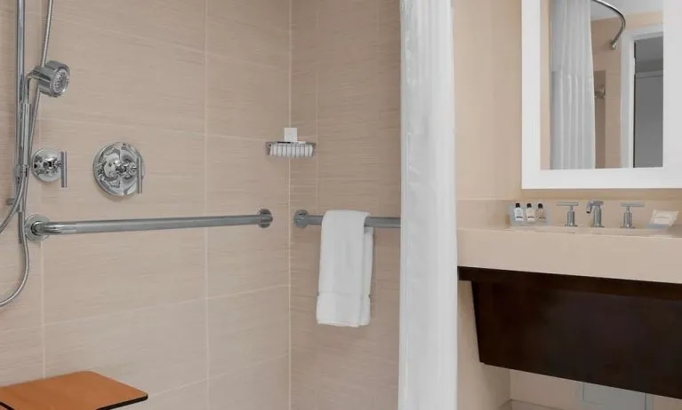 Private guest bathroom with shower at Hilton Garden Inn New York/Times Square Central