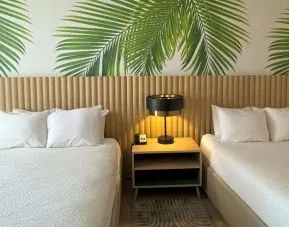 Day room with queen beds at The Harrison Hotel Downtown Hollywood.
