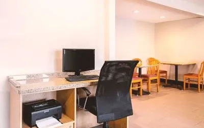 Business center with computer, printer and ergonomic chair at Hotel Inn Milwaukee.