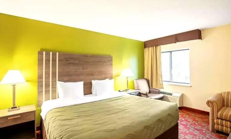 King room with sofa and work desk at Hotel Inn Milwaukee.