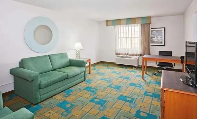 Day use suite's workspace and living area at Norwood Inn & Suites Merrillville.