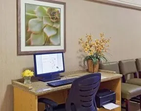 Business center with computer, printer and ergonomic chair at Norwood Inn & Suites Merrillville.