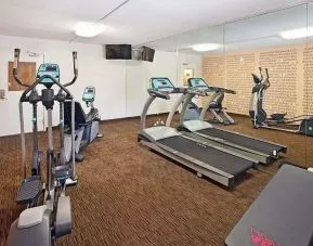 Well equipped fitness center at Norwood Inn & Suites Merrillville.