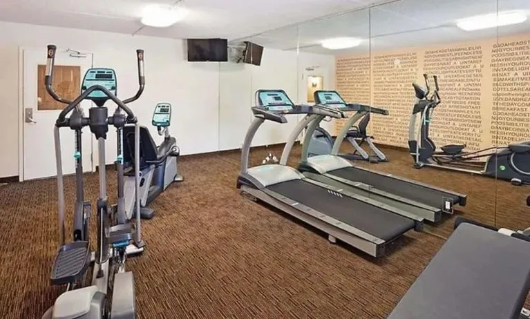 Well equipped fitness center at Norwood Inn & Suites Merrillville.
