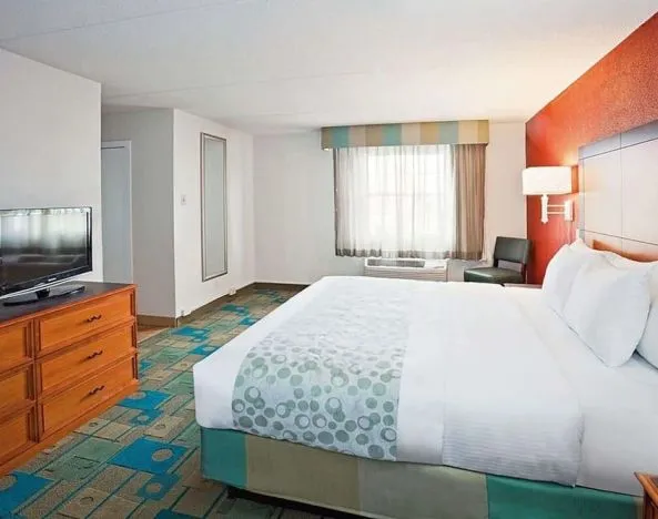 King bed at Norwood Inn & Suites Merrillville.