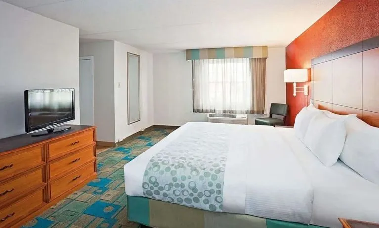 King bed at Norwood Inn & Suites Merrillville.