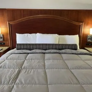King bed at Casa Rosa Inn.