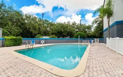 Outdoor pool at OYO Townhouse Orlando West.