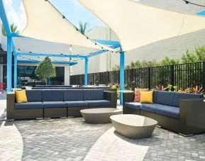 Outdoor seating at Tru By Hilton Ft. Lauderdale Airport.