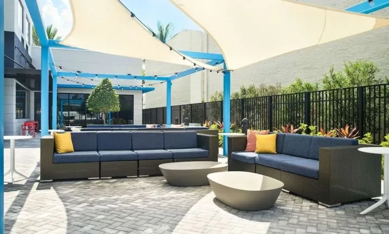 Outdoor seating at Tru By Hilton Ft. Lauderdale Airport.