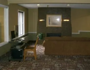 Lobby lounge and workspace at Norwood Inn & Suites - Roseville.