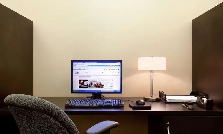Business center with computer, printer and ergonomic chair at Hilton Orrington/Evanston.