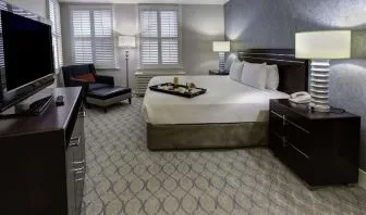 Bright and spacious day use room with work desk and sofa at Hilton Orrington/Evanston.
