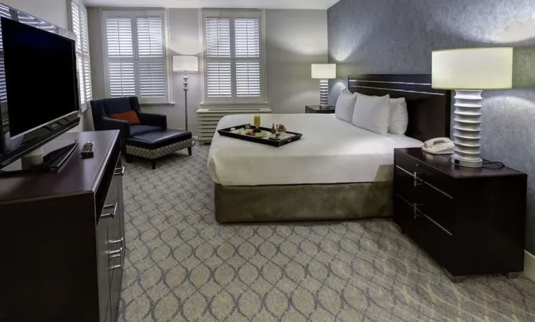 Bright and spacious day use room with work desk and sofa at Hilton Orrington/Evanston.