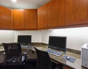 Business center with computers, printer and ergonomic chairs at Hampton Inn & Suites Clovis-Airport North.