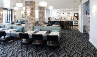 Dining area with comfortable seating perfect for coworking at Homewood Suites By Hilton San Jose Airport-Silicon Valley.