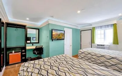 Queen room with mini-fridge at Mid City Inn - Los Angeles.